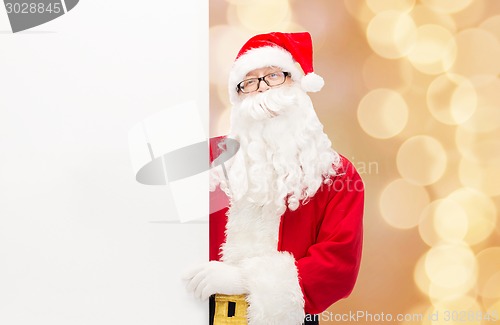 Image of man in costume of santa claus with billboard