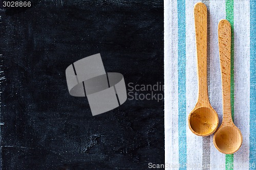 Image of wooden spoons and tablecloth 