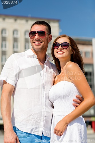 Image of smiling couple in city