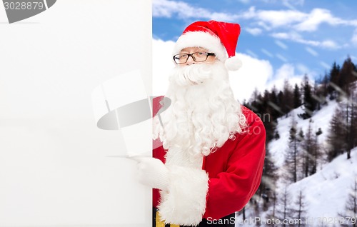 Image of man in costume of santa claus with billboard