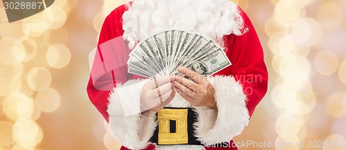 Image of close up of santa claus with dollar money