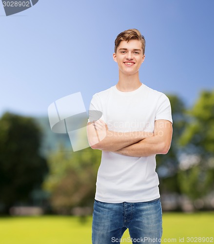 Image of smiling young man in blank white t-shirt