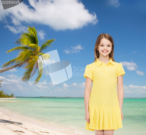 Image of smiling little girl in yellow dress