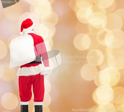 Image of man in costume of santa claus with bag
