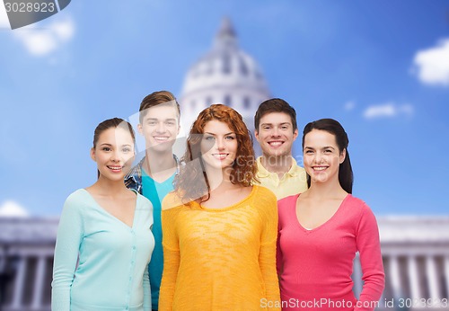 Image of group of smiling teenagers showing ok sign