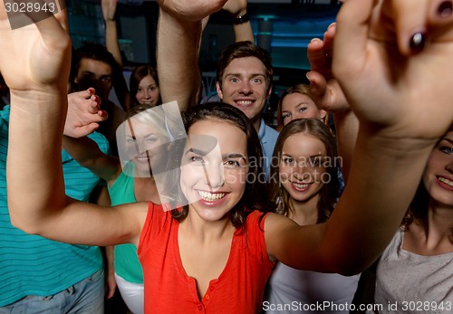 Image of smiling women dancing in club