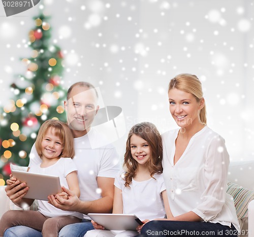 Image of happy family with tablet pc computers at home
