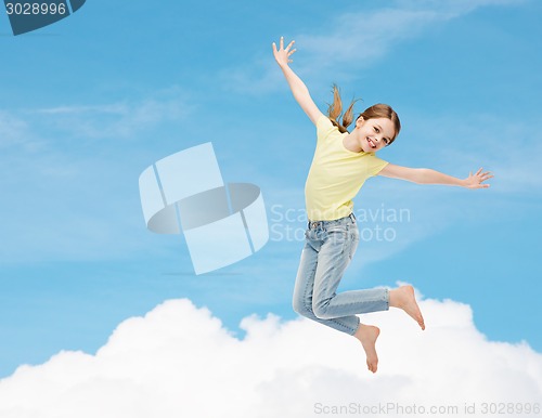 Image of smiling little girl jumping