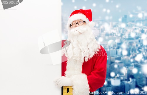 Image of man in costume of santa claus with billboard