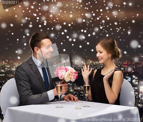 Image of smiling couple at restaurant