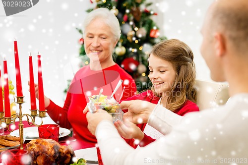 Image of smiling family having holiday dinner at home