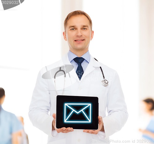 Image of smiling male doctor with stethoscope and tablet pc