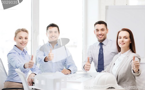 Image of happy team of architects and designers in office