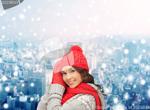 Image of smiling young woman in winter clothes