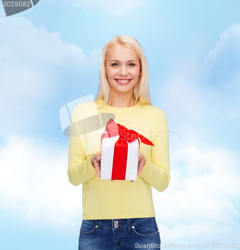 Image of smiling girl with gift box