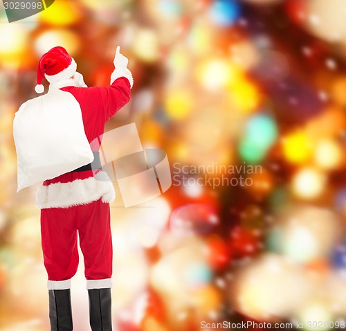 Image of man in costume of santa claus with bag