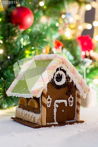 Image of closeup of beautiful gingerbread house at home