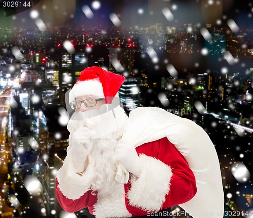 Image of man in costume of santa claus with bag