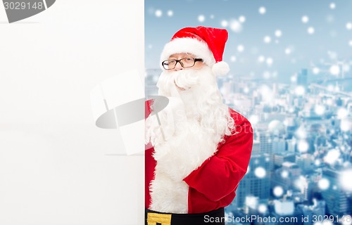 Image of man in costume of santa claus with billboard