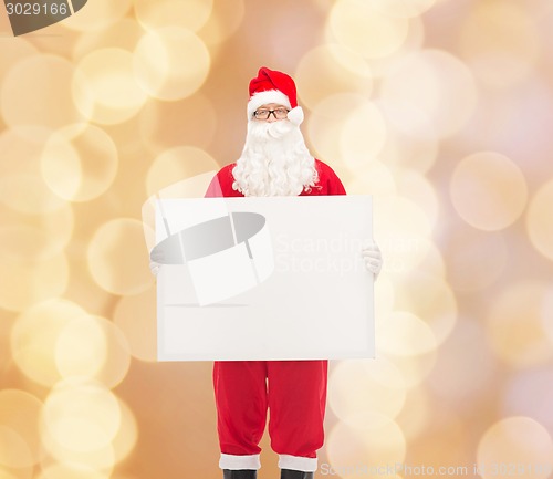 Image of man in costume of santa claus with billboard