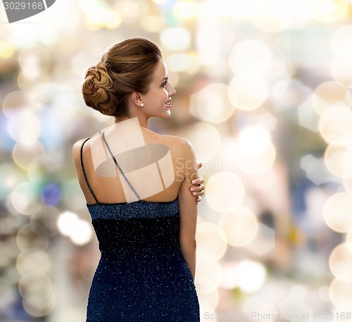 Image of smiling woman in evening dress