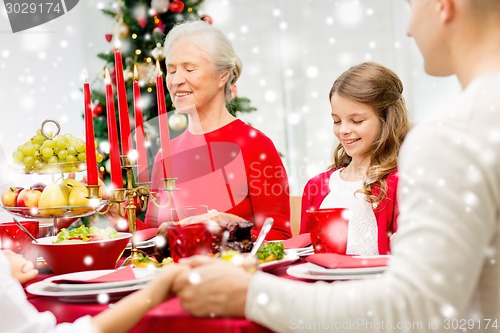 Image of smiling family having holiday dinner at home