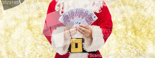 Image of close up of santa claus with euro money