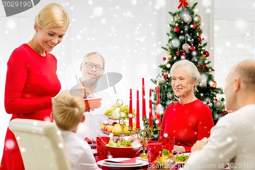 Image of smiling family having holiday dinner at home