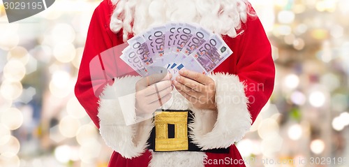 Image of close up of santa claus with euro money