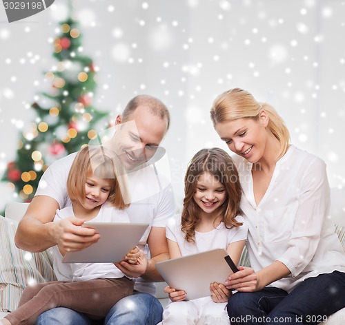Image of happy family with tablet pc computers at home