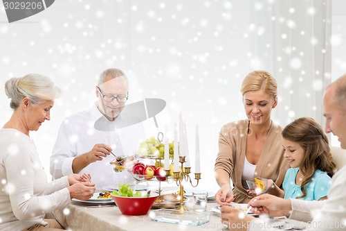 Image of smiling family having holiday dinner at home