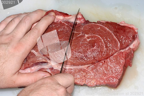 Image of Photo of the juicy beef meat on a cutting board