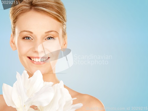 Image of beautiful young woman with bare shoulders