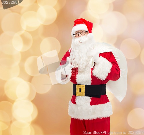 Image of man in costume of santa claus with bag