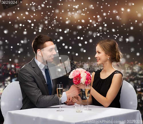 Image of smiling couple at restaurant