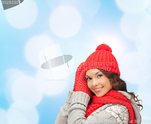 Image of smiling young woman in winter clothes