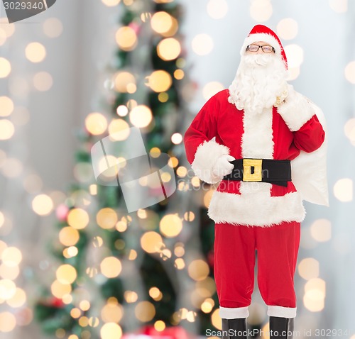 Image of man in costume of santa claus with bag