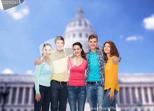 Image of group of smiling teenagers showing ok sign