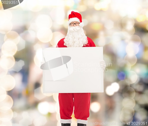 Image of man in costume of santa claus with billboard