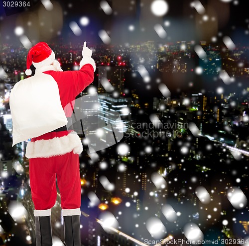 Image of man in costume of santa claus with bag