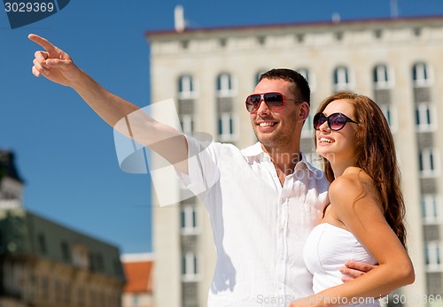 Image of smiling couple in city