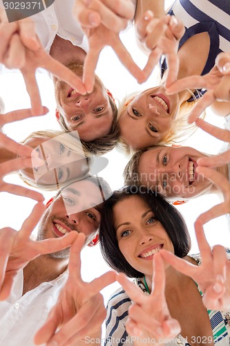 Image of smiling friends in circle