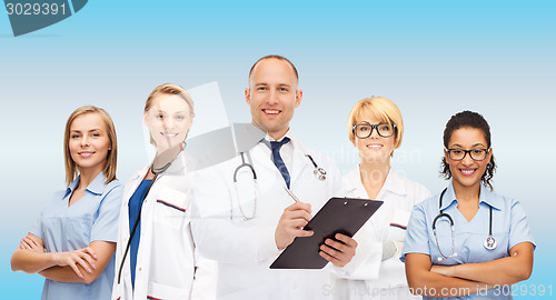 Image of group of smiling doctors with clipboard