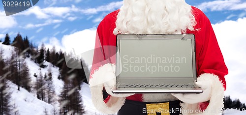 Image of close up of santa claus with laptop