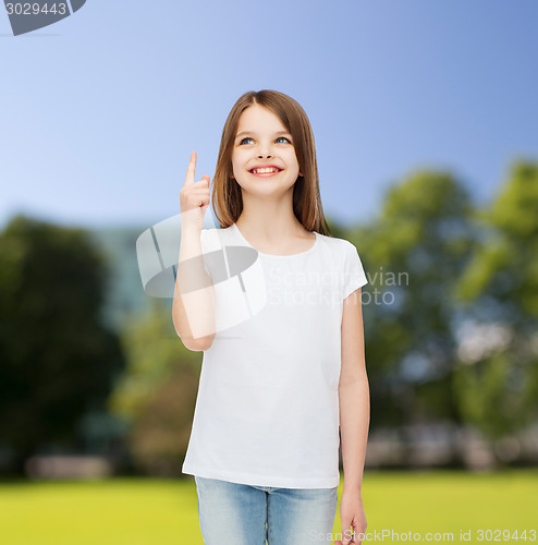Image of smiling little girl in white blank t-shirt