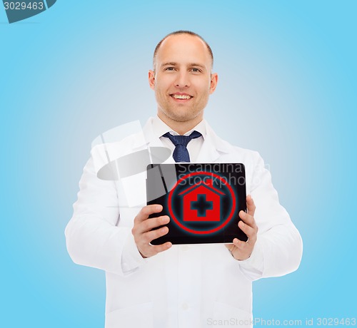 Image of smiling male doctor with tablet pc