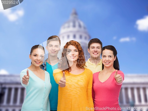 Image of group of smiling teenagers showing ok sign