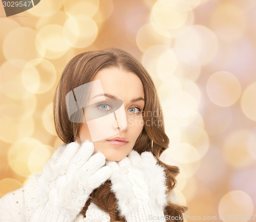 Image of smiling young woman in winter clothes