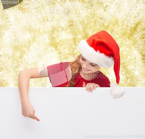 Image of girl in santa helper hat with blank white board