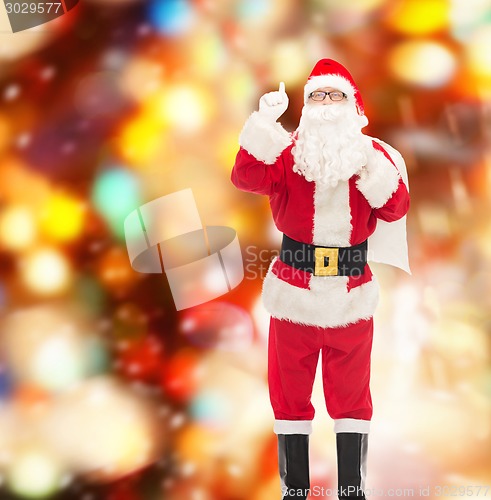 Image of man in costume of santa claus with bag